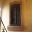 A old door mounted in the wall and custom frame